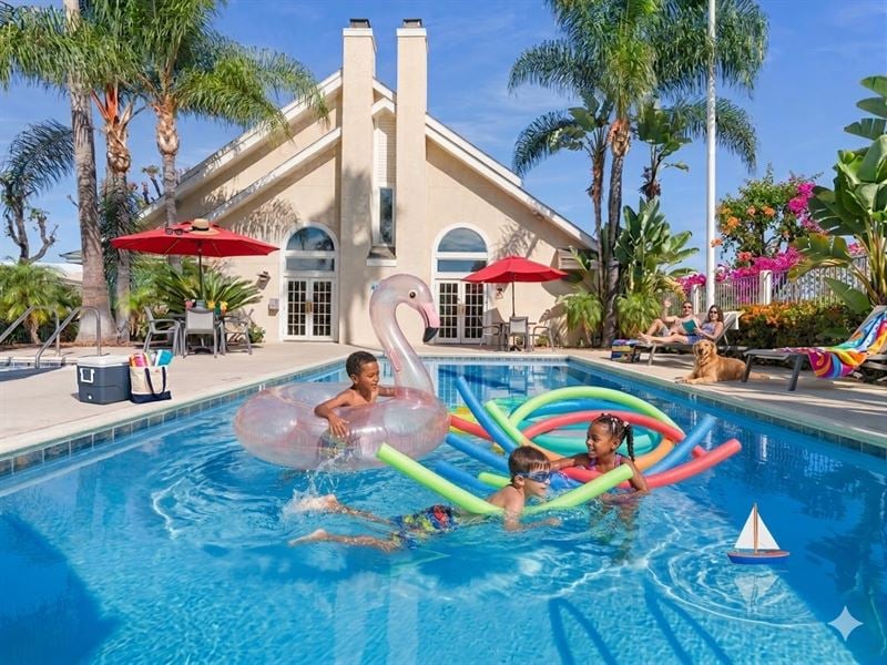 A family of three children play in a swimming pool with various pool toys.